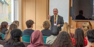 Bambos speaking at Woodhouse College