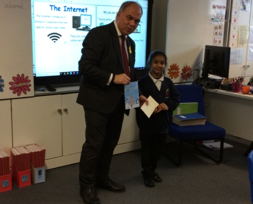 Bambos presenting Nurjahan with her prize at Garfield School