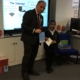 Bambos presenting Nurjahan with her prize at Garfield School