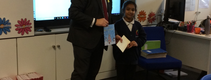 Bambos presenting Nurjahan with her prize at Garfield School