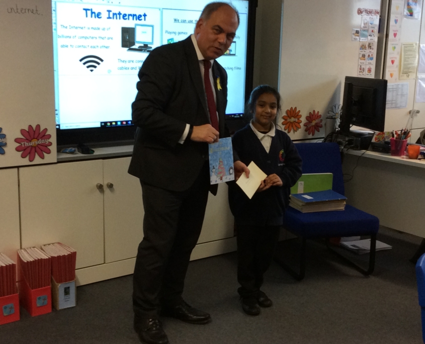 Bambos presenting Nurjahan with her prize at Garfield School