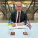 Bambos Charalambous MP signing the UK Parliament Book of Solidarity for Ukraine