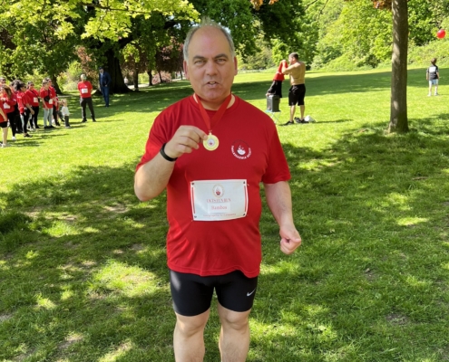 Bambos Charalambous MP holding his medal following the Thalassaemia fun run