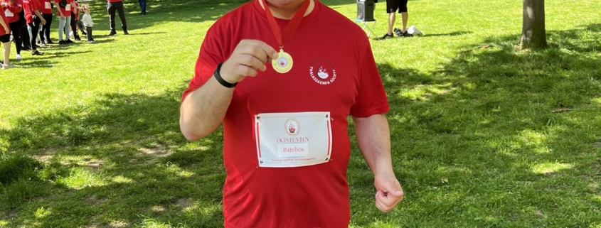 Bambos Charalambous MP holding his medal following the Thalassaemia fun run