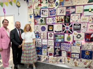 Bambos Charalambous MP visiting the Jubilee collage by Stitch and Inspirational Embroidery and funded by the London Community Fund