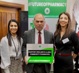 Bambos Charalambous MP holding sign which reads "I support England's 11,000+ community pharmacies"