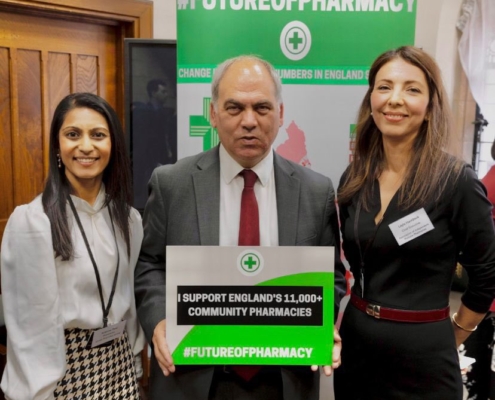 Bambos Charalambous MP holding sign which reads "I support England's 11,000+ community pharmacies"
