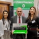 Bambos Charalambous MP holding sign which reads "I support England's 11,000+ community pharmacies"