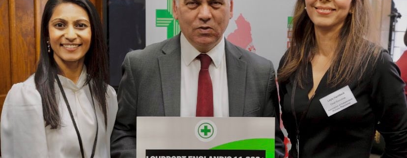 Bambos Charalambous MP holding sign which reads "I support England's 11,000+ community pharmacies"