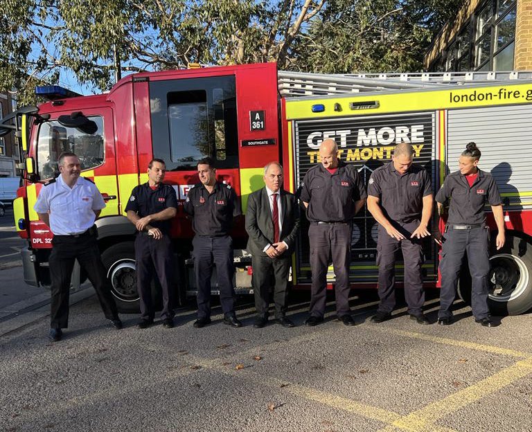 Bambos Charalambous MP and firefighters outside Southgate Fire Station