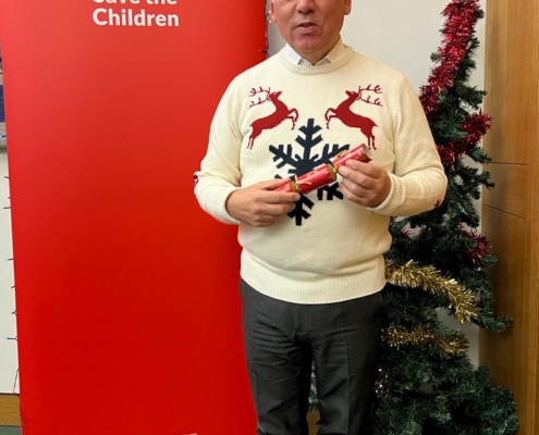 Bambos Charalambous MP wearing a Christmas jumper to support Save the Children's Christmas Jumper Day