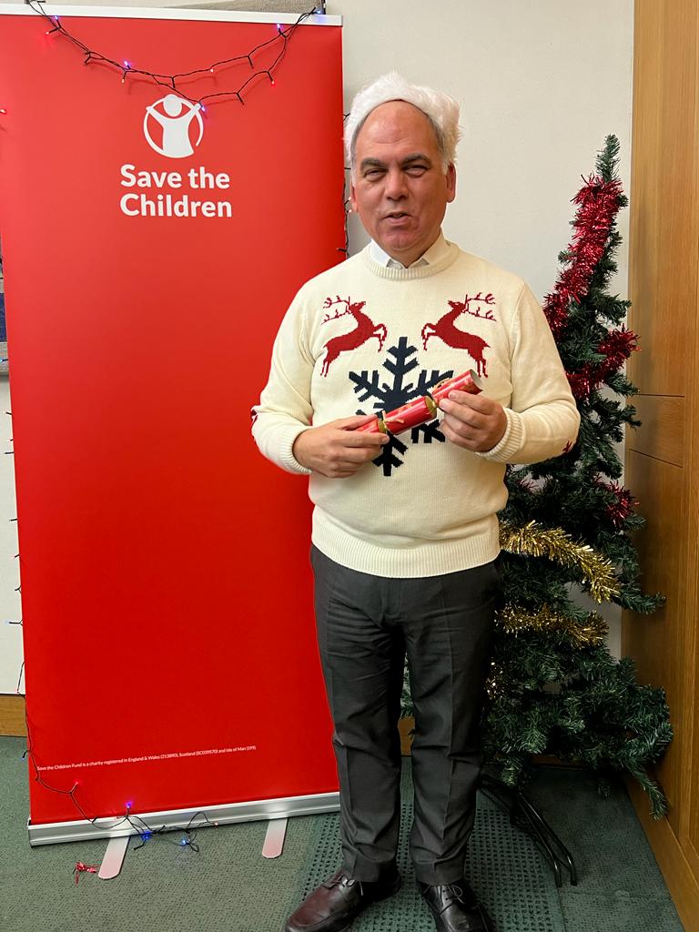 Bambos Charalambous MP wearing a Christmas jumper to support Save the Children's Christmas Jumper Day