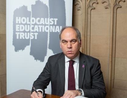 Bambos Charalambous MP signing the Holocaust Educational Trust's Book of Commitment in Parliament