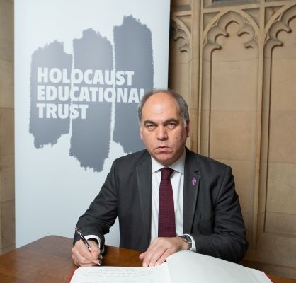 Bambos Charalambous MP signing the Holocaust Educational Trust's Book of Commitment in Parliament