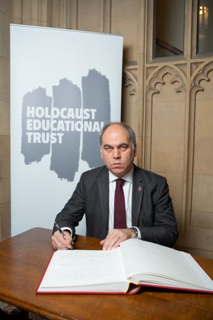 Bambos Charalambous MP signing the Holocaust Educational Trust's Book of Commitment in Parliament