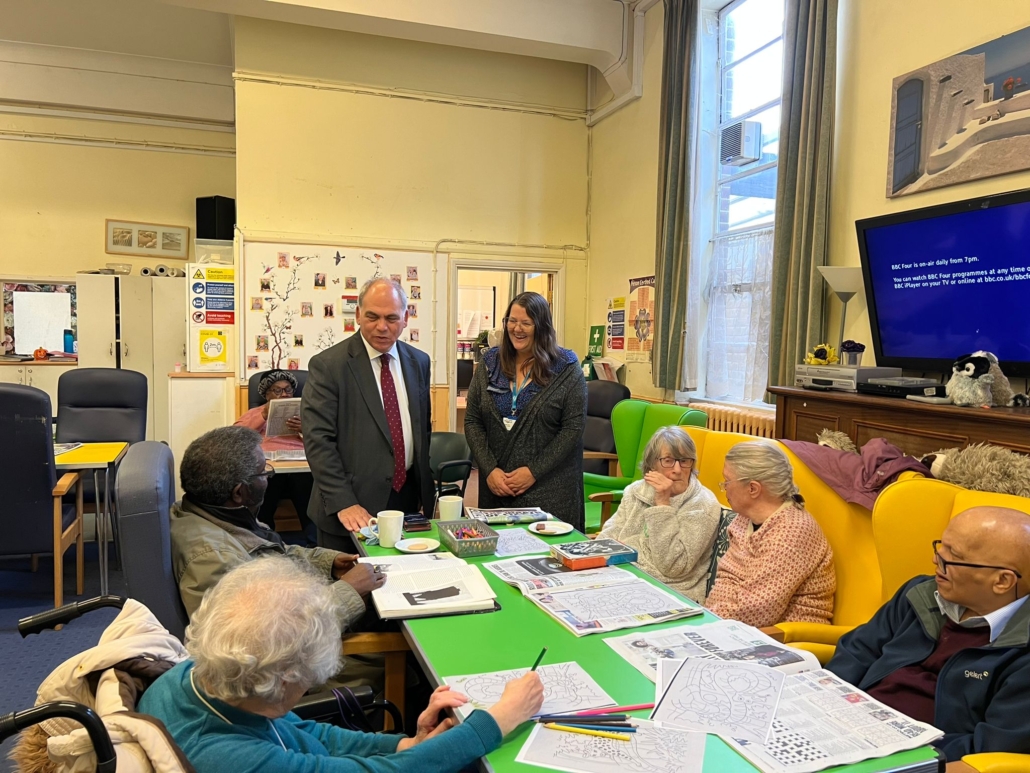 Bambos Charalambous MP speaking to members at Age UK's dementia day centre in Enfield