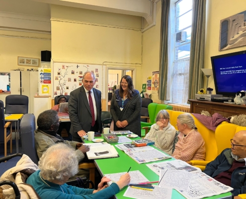 Bambos Charalambous MP speaking to members at Age UK's dementia day centre in Enfield